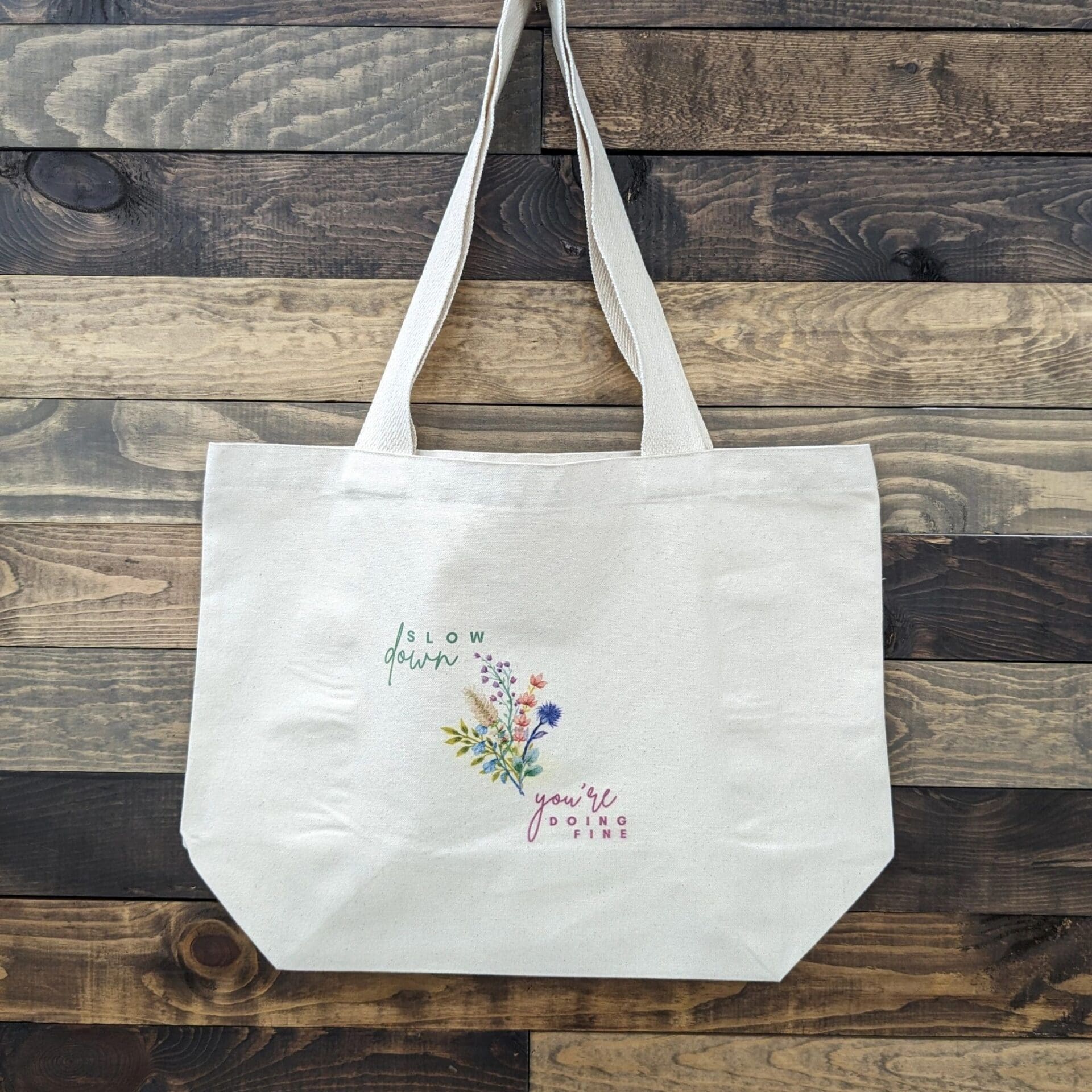 Beige tote on wooden background